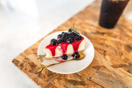 Blueberry cake on a plate in a cafe,sweets in a coffee shopの写真素材