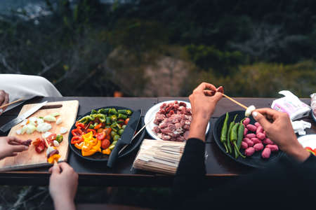 Barbecue and pan-roasted meat at rest on the mountainの写真素材