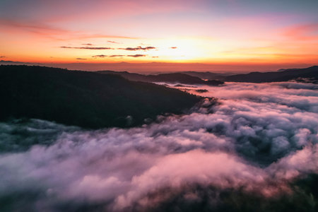Flying above the clouds sunrise and fog,on the hill