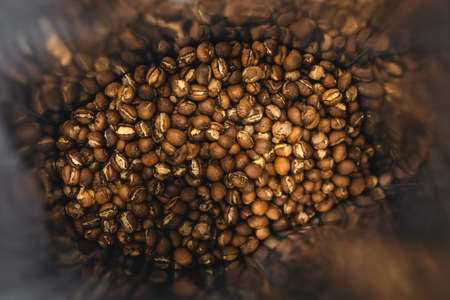 Coffee from the machine in a coffee mug in the shopの写真素材