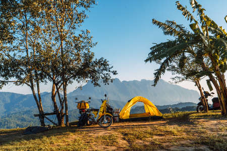 Yellow camping on the mountain, mountain view in the morningの写真素材