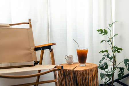 Iced coffee in a cup in the room,iced coffee in a mug at homeの写真素材