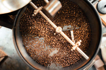 Roasted coffee beans in a cooling machine,freshly roasted coffee beansの写真素材