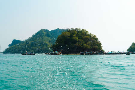 boat tour rocky mountain island in the seaの写真素材