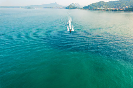 Sea views and rocky islands with a long-tail boat.form above in krabi