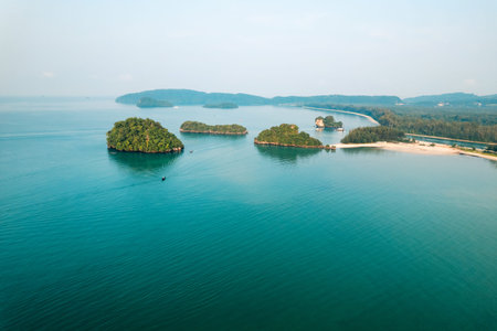 in the blue sea from above,boat and island