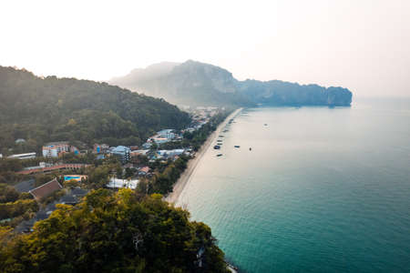 in the blue sea from above,boat and islandの写真素材