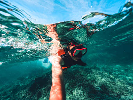 Snorkeling in the sea on a tropical island,clear divingの写真素材
