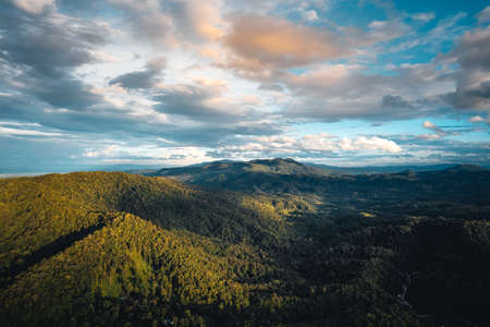 mountains and green trees in the evening.high angle viewの写真素材