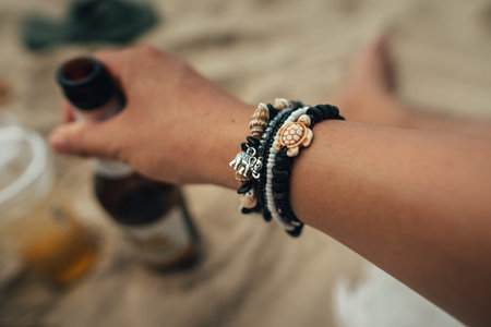 Souvenirs on the island, sea bracelets on the wrist at the beach