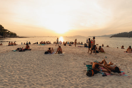 Seaside beach and sunset, people come to sit and watch the view.