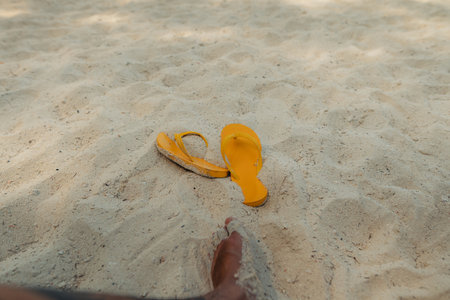 Feet at the beach by the sea in the evening,seasideの写真素材