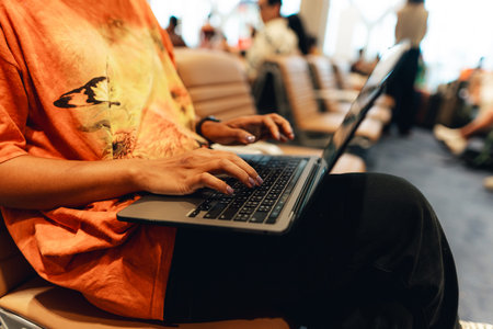 Using a laptop at the airport before travelling.