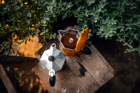 Coffee from a moka pot in the morning with green leavesの写真素材