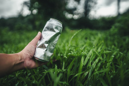 Aluminum cans on the lawn, recycle, save nature