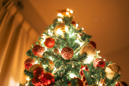 Christmas tree and ball decorations with small lights in the house,Festival backgroundの写真素材