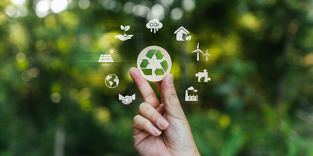 Sustainable environment recycling and nature conservation Hand with recycling sign natural blur backgroundの写真素材