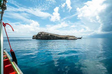 View of the island from the boat, rocks and islands during the day, summer travelの写真素材