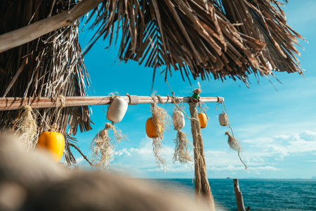 traditional fishing buoys and weathered ropes, beautifully arranged as seaside decoration against...