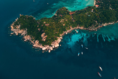 angle aerial photograph revealing the stunning clarity and color variations of the waters around Koh Tao, Thailandの写真素材
