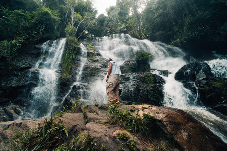 Natural waterfall in the middle of the forest, tourism and trekking