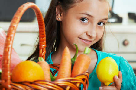 The nice girl with fruit and vegetablesの写真素材