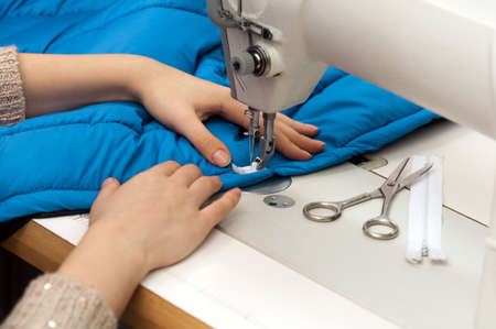 work at the sewing machine close-upの写真素材
