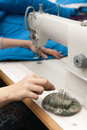 she takes pins with pads and sew