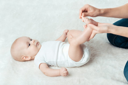 Little baby with mum is making massage