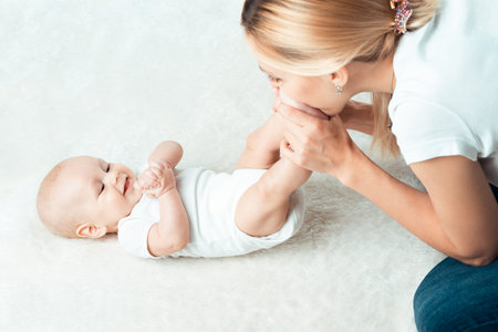 Little baby with mum is making massage