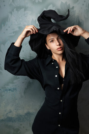 beautiful girl in a witch costume sexy looks