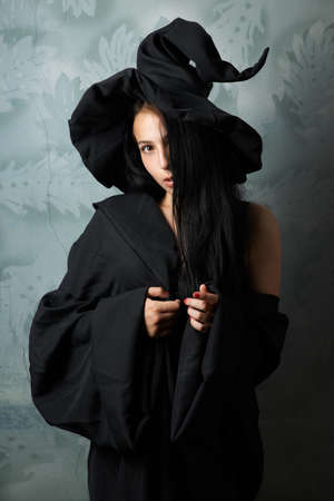beautiful girl in a witch costume sexy looksの写真素材