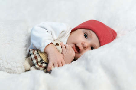 cute baby in red hat smilingの写真素材