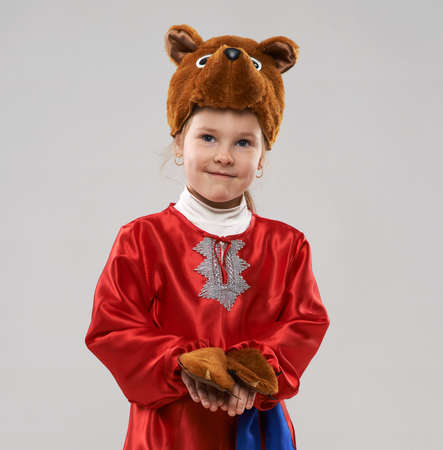 Cute  red-haired girl in a suit of the Slavic bearの写真素材