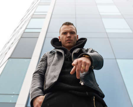 big strong man points a finger at youの写真素材