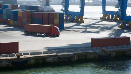 wagon carries a large container in the port terminalの写真素材