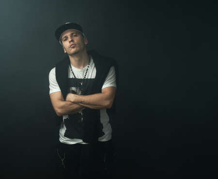 Fashionable stylish man in the darknessの写真素材