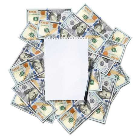 sheet of paper for notes with a pen on dollar