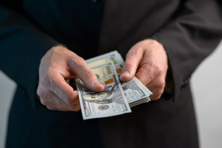 man counts the money and gives