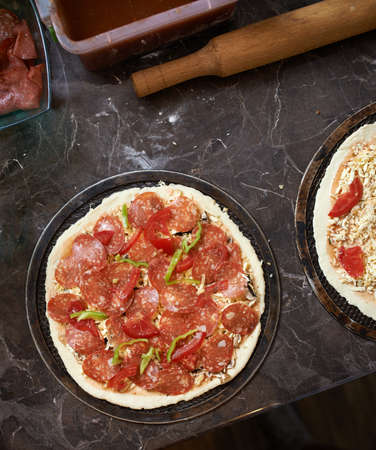 harvesting pizza with bacon on the tableの写真素材