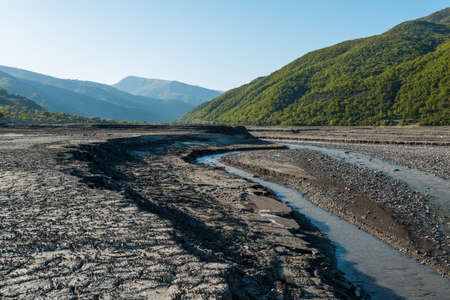dry mountain river flowing brookの写真素材
