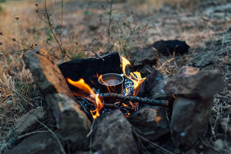 coffee cooked over a campfire on the natureの写真素材