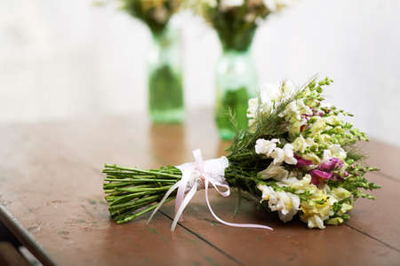 There is one  handmade wedding bouquet on the tableの写真素材