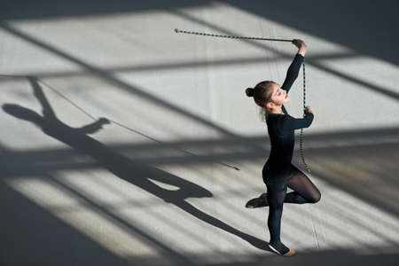 Girl exercising with rope on the rhythmic gymnasticsの写真素材