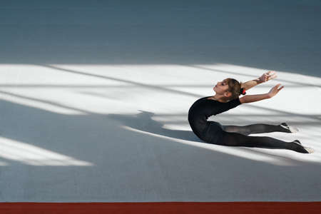 Girl doing backfold  rhythmic gymnasticsの写真素材