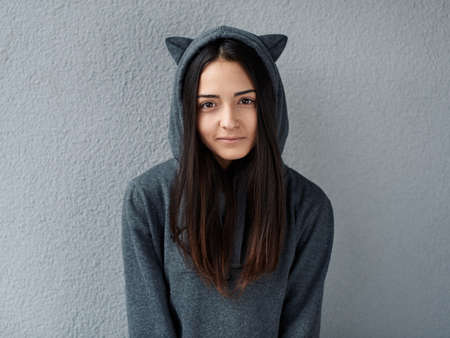 Pretty teenage girl looking at the cameraの写真素材