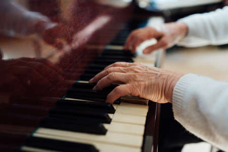 skilled hands of the old masters of the piano closeupの写真素材
