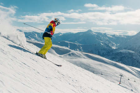 girl with special ski equipment is riding fast, jumping, freeriding very fast in the mountain forestの写真素材