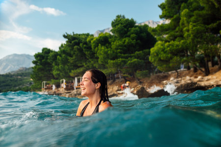 girl is bathing in the sea