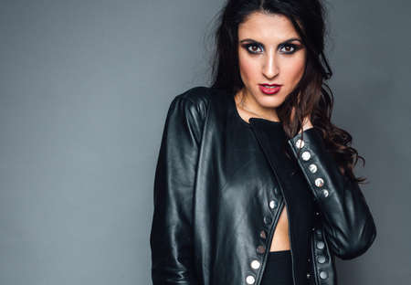 girl in a leather jacket with bright makeupの写真素材